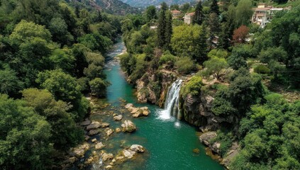 Serene Aerial View of Lush Green Forest Surrounding Crystal Clear River with Tranquil Waterfall in Natural Landscape Harmony