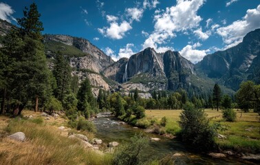 Serene Landscape of Yosemite National Park Featuring Majestic Mountains, Clear Stream, Lush Greenery, and Vibrant Blue Sky Under Fluffy Clouds