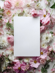 Blank paper surrounded with flowers feels sweet