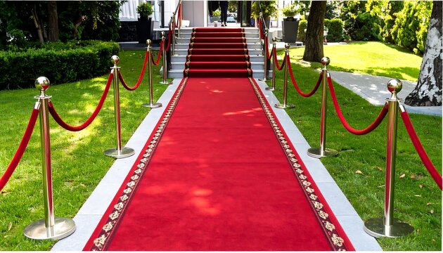 Red carpet entrance with VIP ceremony, luxurious event, front yard, building, and garden path.