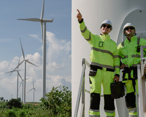 Maintenance engineer team standing at windmills at wind turbine farm. Group of people wear safety...
