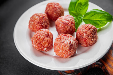 Meatballs raw meat pork, beef, chicken fresh delicious gourmet food background on the table rustic...
