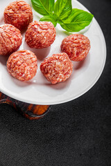 Meatballs raw meat pork, beef, chicken fresh delicious gourmet food background on the table rustic...