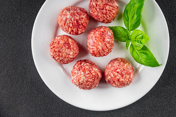 Meatballs raw meat pork, beef, chicken fresh delicious gourmet food background on the table rustic...