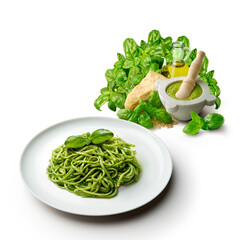 Plate of linguine with Genoese pesto sauce with mortar and ingredients