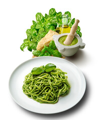 Plate of linguine with Genoese pesto sauce with mortar and ingredients