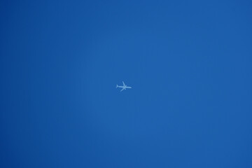 Airplane flying in the blue sky. Airplane in the blue sky.