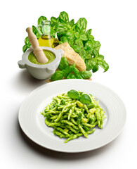 Typical Genoese dish of trofie with pesto with mortar and ingredients