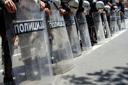 Serbian riot police keeps their shields down during peaceful protests