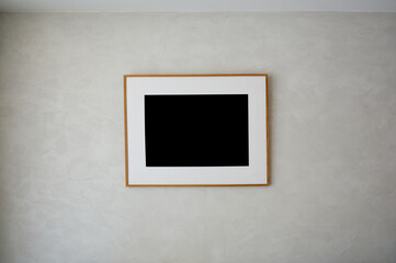 picture mockup. Empty Square Wooden frame on white wall. Poster mockup. minimal frame. Indoor interior.