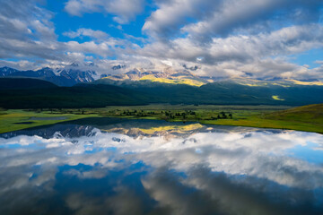 Beautiful summer landscape Dzhangyskol lake with reflection of mountains Altai, drone aerial view