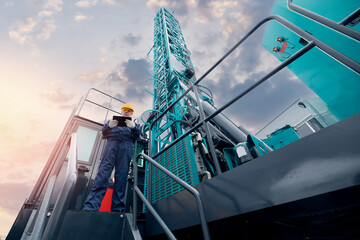 Industry operator use computer tablet for control rig platform for drilling wells for installing...