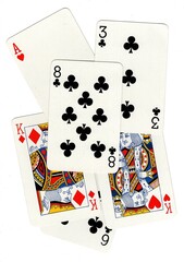 A random selection of playing cards isolated on a white background.