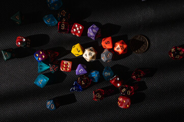 Scattered Polyhedral Dice on Black Background