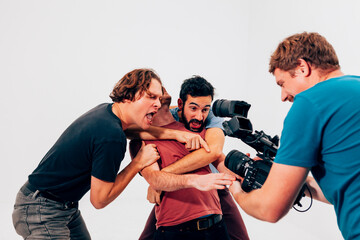 Group of friends filming a fun scene together