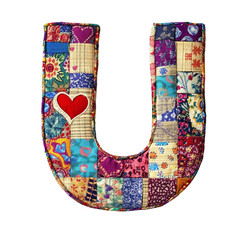 Colorful patchwork letter U with a heart detail on black background