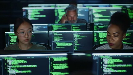 A diverse team focused on coding in a modern tech environment. - Powered by Adobe