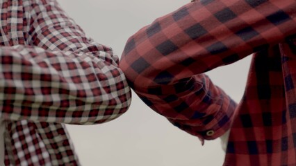 two businessmen touch elbows social distance. bump avoid greeting. coronavirus pandemic concept. two men meeting greet each other at distance observing social distance. bump avoid lifestyle greeting.