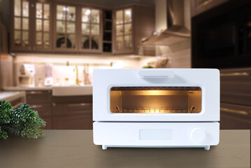 Generawhite modern design toaster oven is on brown black wooden table with small plant background...