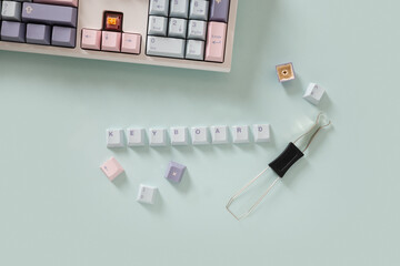 Concept cleaning and customization keycaps in modern mechanical keyboard on blue background. Custom...