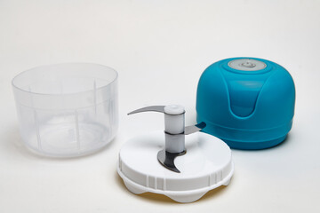 Portable cordless blender with steel blades for chopping fruits and vegetables.
