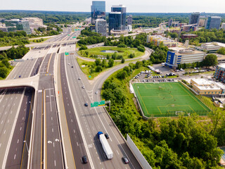Tysons skyline with highway interchange. City planning and transportation hub.