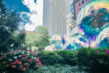 Colorful public art in Charlotte, North Carolina. Reflective balloons brighten the urban landscape.