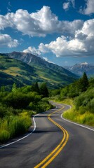Winding asphalt highway through the Canadian mountains on a clear summer day with a vast sky and forested landscape