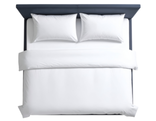 An inviting modern bed with pristine white bedding and a sleek dark blue headboard viewed from above.