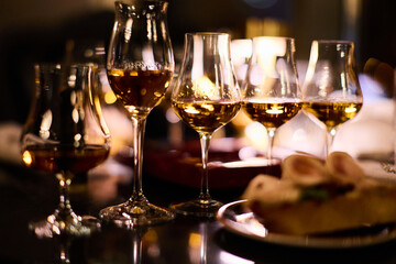 Luxury whiskey glasses in warm lighting