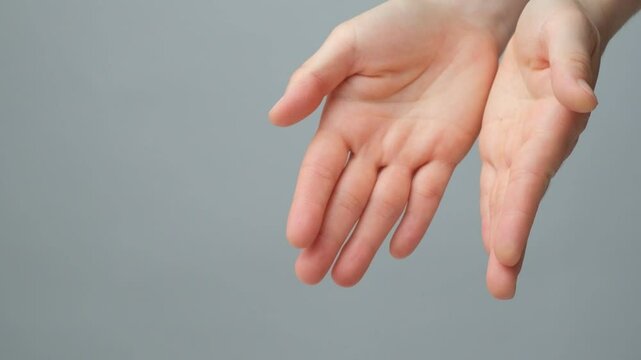 Hands pour raw uncooked vicia faba beans slow motion