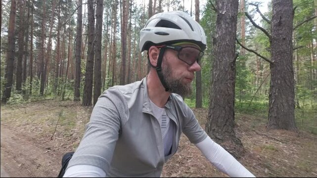 cycling in nature in wild places, bike-packing. A blogger makes a video for social media about his journey