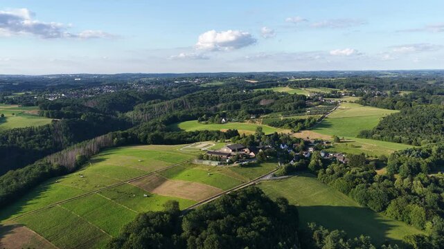 Landscape of the germany eiffel region, covered with vast forests and hilly terrain. Aerial view of the landscape.