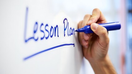 Hand writing lesson plan on whiteboard marker blue