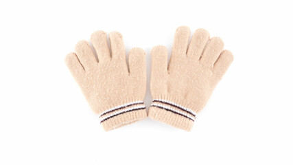 Soft beige gloves placed on a white background