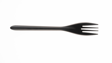 Black plastic fork on a plain white background