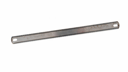 Metal saw blade lies on a white background