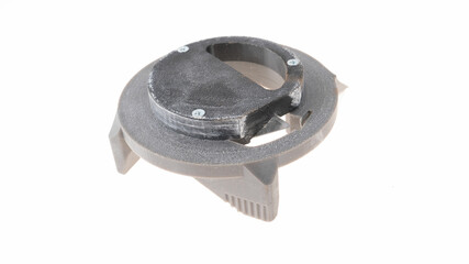 Plastic component piece on white background