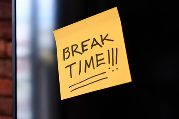 Sticky note reminding employees to take a break and recharge
