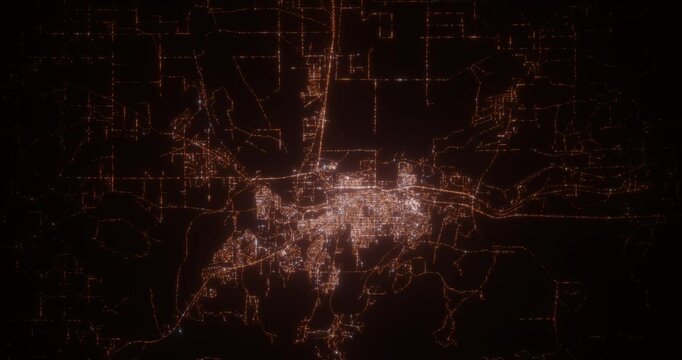 Casper (Wyoming, USA) aerial view at night. Top view on modern city with street lights. Camera is flying above the city, moving backward