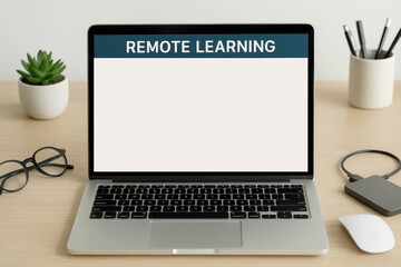 Fototapeta premium Modern workspace setup with laptop displaying remote learning desk technology