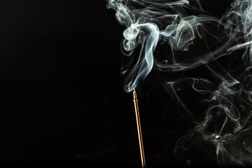 Waves of white smoke, incense smoke isolated on a black background.