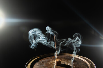 Waves of white smoke, incense smoke isolated on a black background.