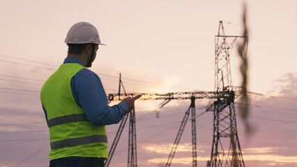 technology concept with high voltage power lines. electrical engineer helmet digital tablet sunset. power engineer power plant high voltage voltage energy. concept electrical engineer working sunset. - Powered by Adobe