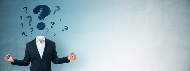 Businessman in suit with head replaced by floating question marks on gradient blue background,...