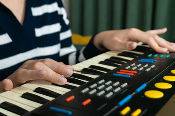Female musician composing electronic music using a vintage synthesizer keyboard, evoking nostalgia...