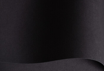 Elegant black designer paper texture with fine, smooth surface. Monochrome backdrop featuring dark
