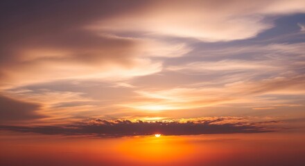 Fiery Sunset with Orange and Purple Sky and Wispy Clouds