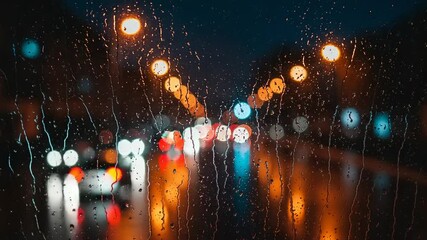 Rainy night city lights through a window - Powered by Adobe