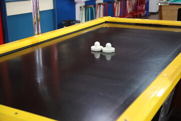 
Air hockey table in arcade game room